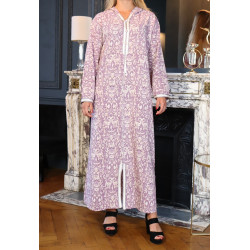 Fluid Moroccan djellaba style dress with purple floral patterned hood on a beige...
