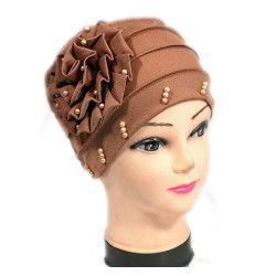 Beaded hat with a large flower on the side in solid beige color